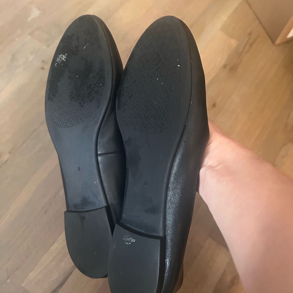Tory Burch Black Flats with Gold Emblem - Picture 3 of 8